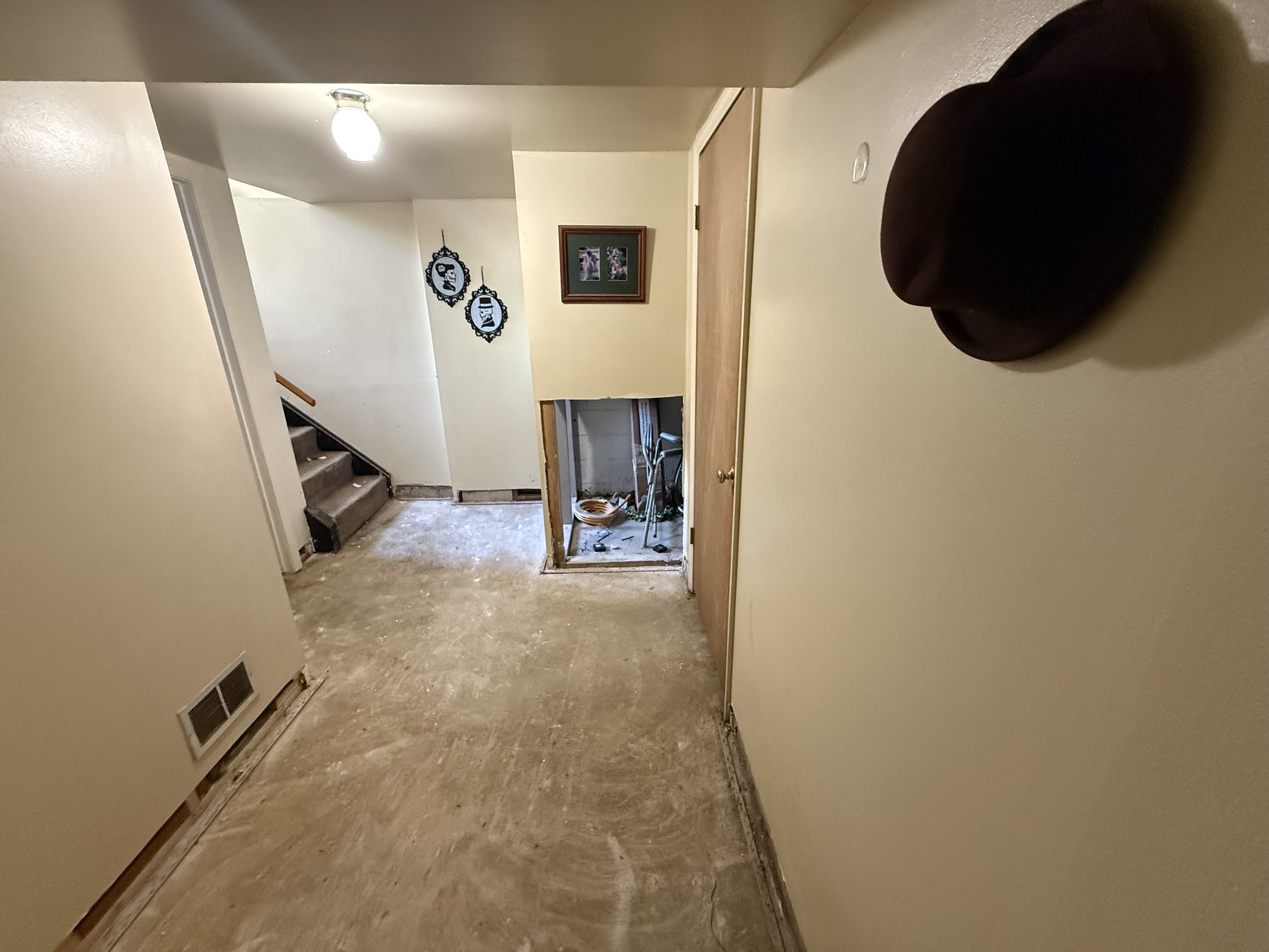 Clean exposed subfloor and professional drywall flood-cuts