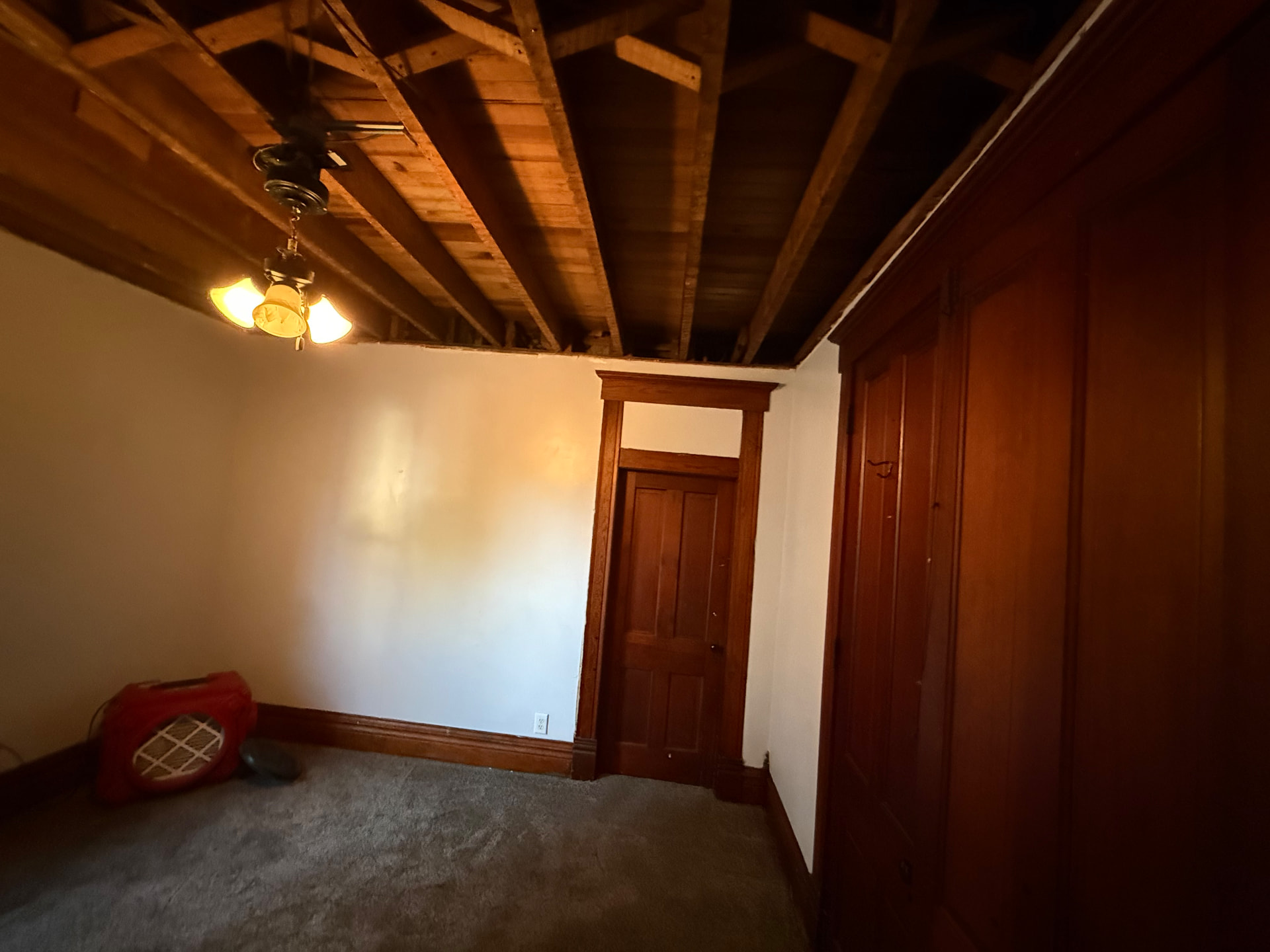 Cleaned-out room with air scrubber still running after mold removal