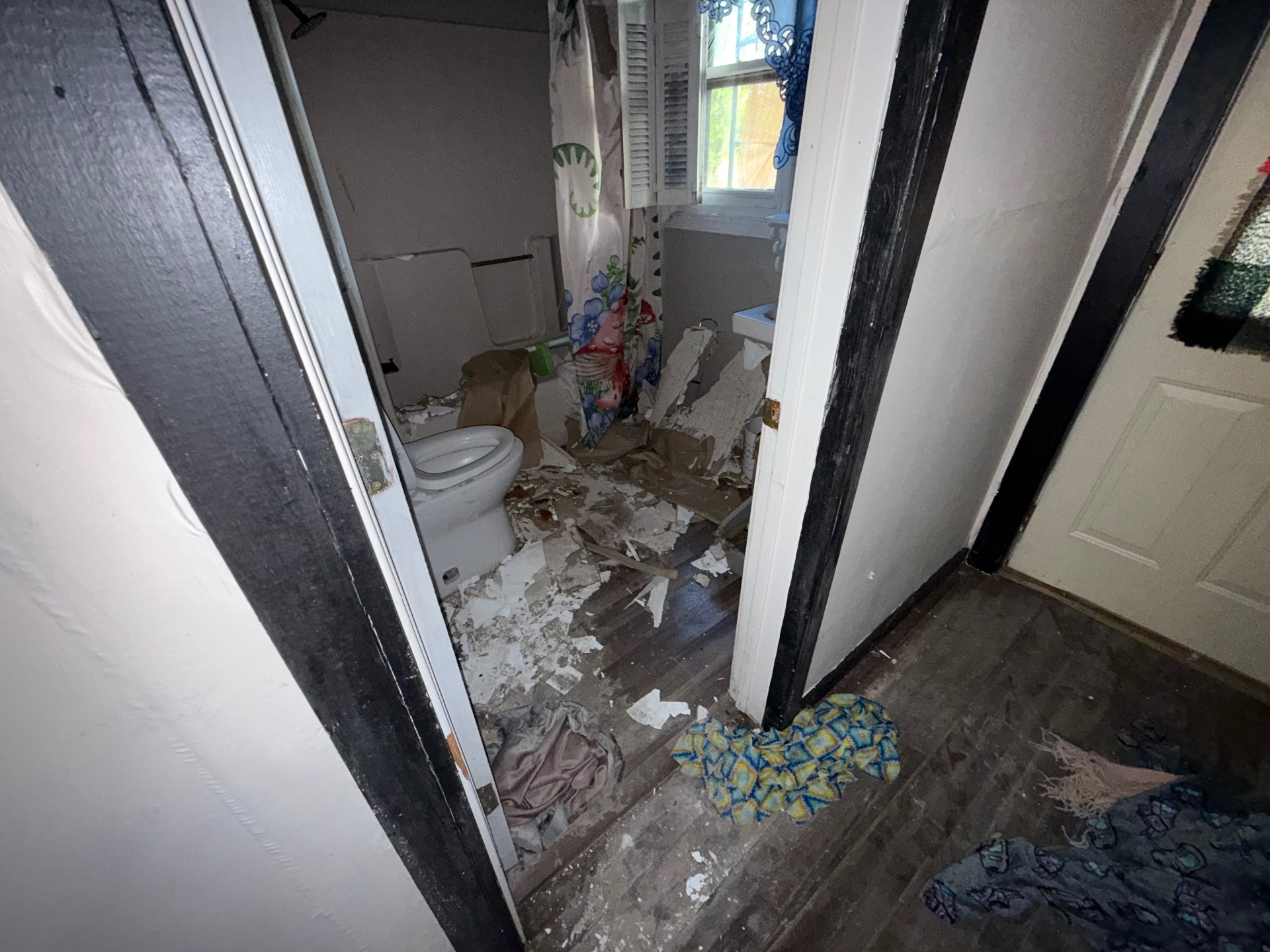 Bathroom with damaged wall material before water mitigation and cleanup in Central Ohio